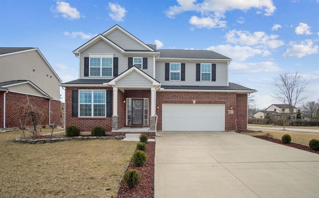 Exterior of colonial home sold in the Sheldon Estates subdivision of Canton Township MI