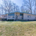 Front exterior of a mid-century modern ranch home sold in Southfield, MI, within the Birmingham School District.