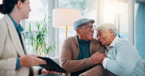 Tablet, Top Selling Realtor And Senior Couple In Office, Smile And Congrats. Old Man And Happy Elderly Woman With Embrace, Closing on a Home, Home Sales