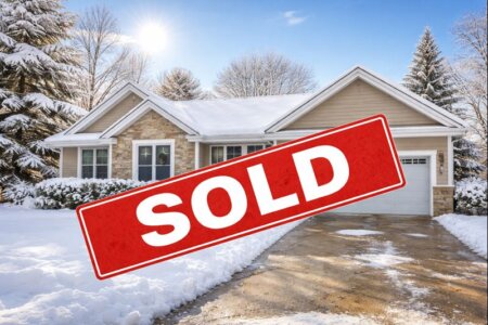 One story house in the winter with SOLD