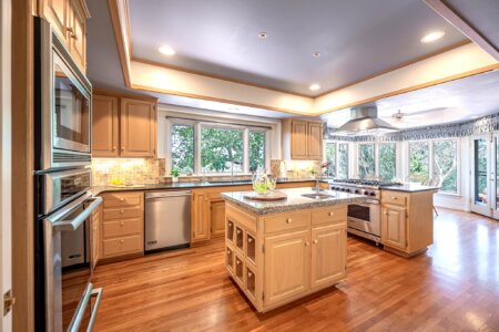 Gourmet kitchen inside a Fallbrook property with Sub-Zero fridge and Viking range