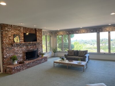 Brick fireplace and views inside Fallbrook homes for sale