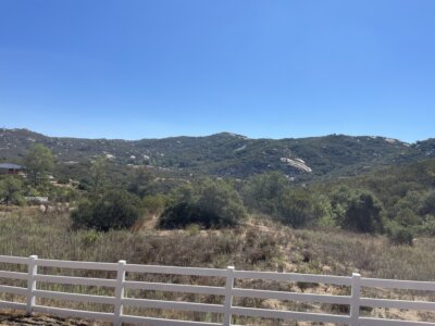 Rainbow Heights land for sale Fallbrook – white fence with mountain views