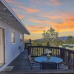 Mid-century modern home deck and sunset view