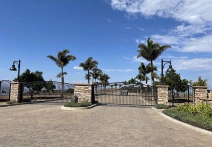 Gated community entrance in Vista California where real estate fraud was discovered after imposters could not provide property access code
