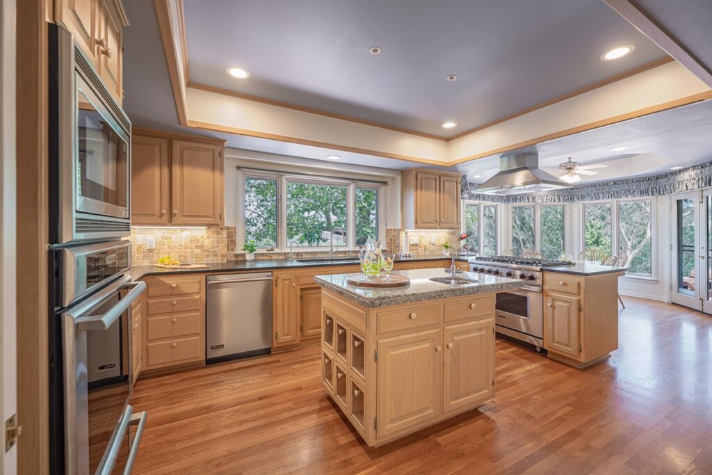 spacious kitchen with center island and countryside views at the Fallbrook Open House.