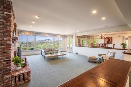 Spacious living room with fireplace and large window