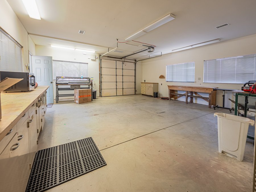 Oversized workshop interior with A/C, 220V power, and flexible work space at 145 Yucca Rd Fallbrook.