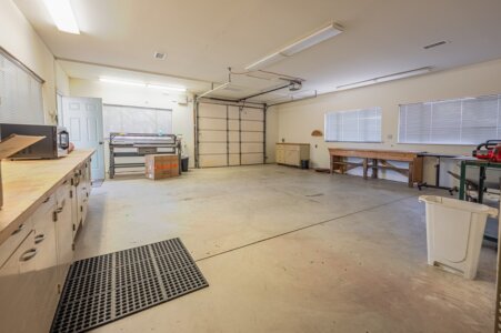 Workshop with A/C, shelving, and storage space