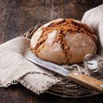 Fresh Bread On Wooden Table