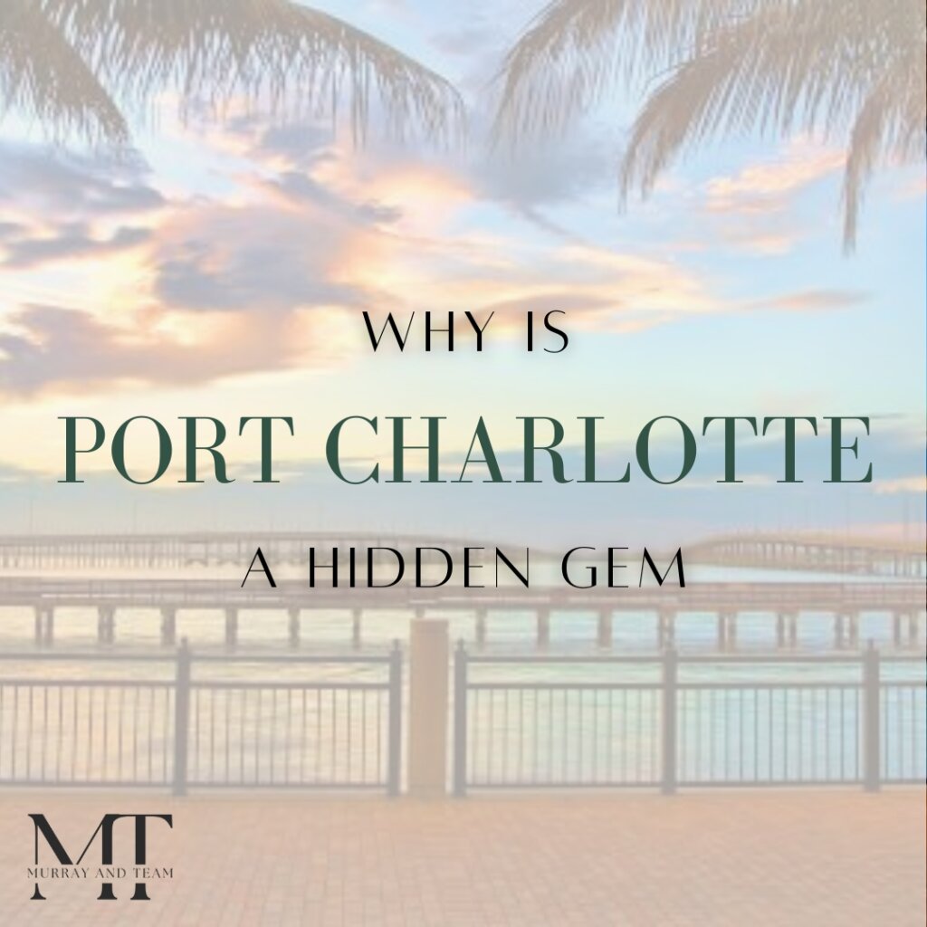 Scenic waterfront view at sunset in Port Charlotte, Florida with palm trees and bridge in the background.