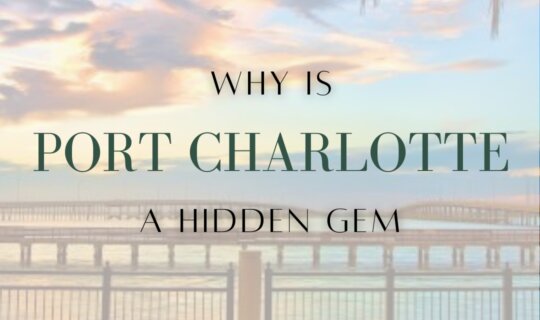 Scenic waterfront view at sunset in Port Charlotte, Florida with palm trees and bridge in the background.